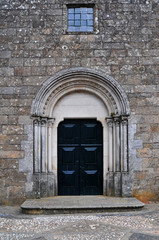 a church closed door with a window in the top