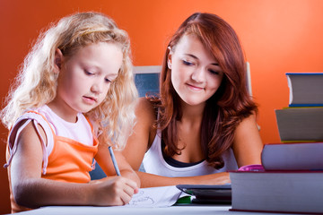 schoolgirls with the books making homework 1