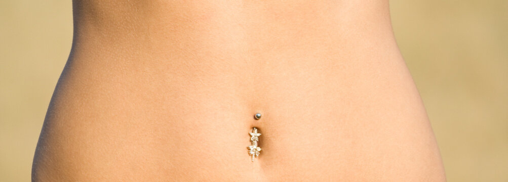 Young female torso with piercing