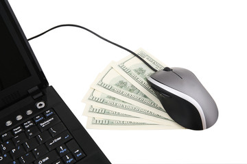 A laptop computer with mouse and five one hundred dollars notes