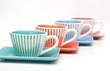 four cups of coffee isolated on white