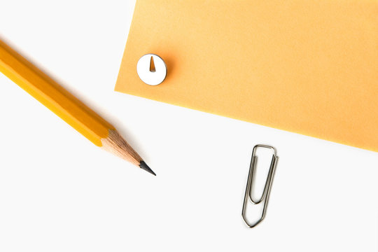a photo of yellow pencil, knob and yellow paper