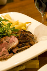 A delicious tender piece of steak on a plate.