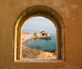 arched window on the coastal landscape of a bay - 9324195