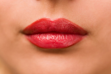 Close-up of beautiful red lips, soft focus