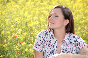 allergy free! pretty young woman on a meadow smiling