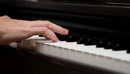 Fototapeta premium I music maker! Closeup photo of piano player mans handle.