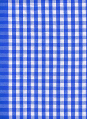 Background from a natural fabric in a blue and white cell
