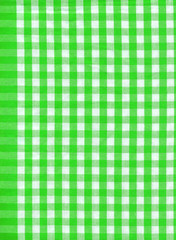 Background from a natural fabric in a green and white cell