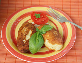 Juicy pork chops with a garnish from greens