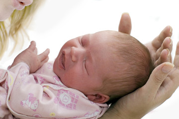 Sleep Baby on a mother hands