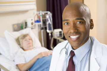 Fototapeta premium Doctor Smiling In Patients Room