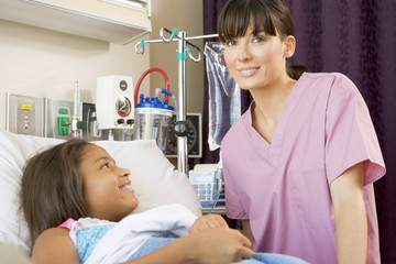 Obraz premium Nurse Checking Up On Young Patient