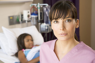 Obraz na płótnie Canvas Nurse Standing In Hospital Room