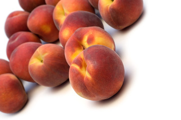 fresh peaches on white background