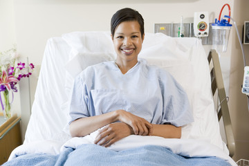 Obraz premium Woman Sitting In Hospital Bed