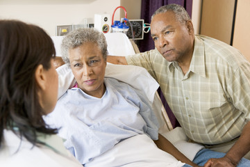Doctor Talking To Senior Couple - Powered by Adobe