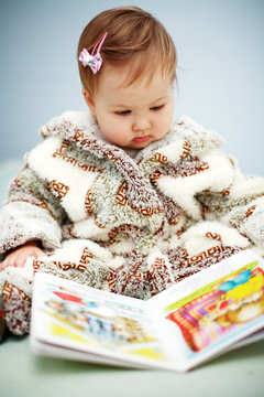 Small cute  reading a book