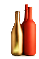 One gold and two red bottles isolated over white background