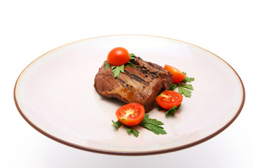 grilled meat on dish over white