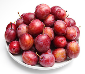 Plums on a white background
