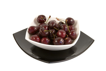 Plateful of cherry on a white background