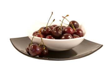 Plateful of cherry on a white background