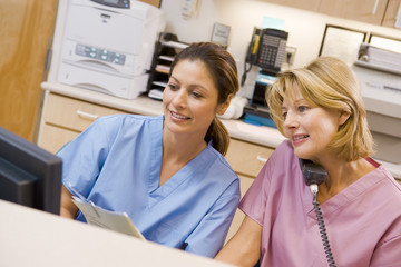 Nurses At The Reception Area In A Hospital