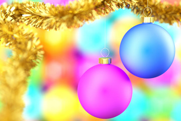 Fototapeta premium Colorful christmas balls over a blurred background.