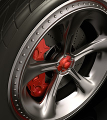 Obraz na płótnie Canvas Close of chromed wheel with red details. Exclusive design.