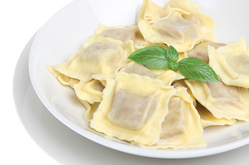 Simple ravioli pasta dish on white background