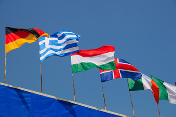 various national flags flapping in the wind