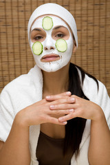 attractive brunette woman with facial mask
