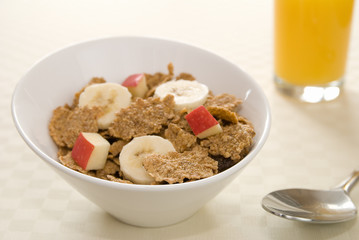 Healthy breakfast with cereal and orange juice.