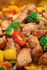 Sesame chicken breast with colorful crispy vegetables