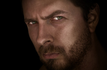 Dark closeup face portrait of masculine guy
