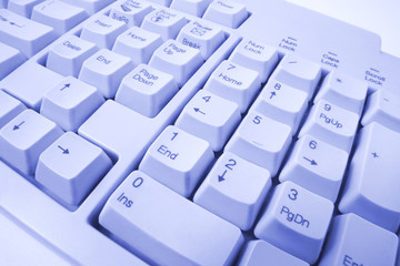 Close Up of Computer Keyboard in Blue Tone