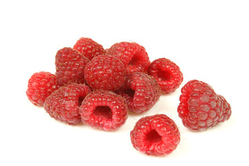 Ripe red raspberries isolated on white background