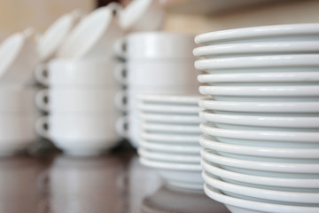 Fototapeta na wymiar plates kitchenware, focused at front