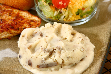 Mashed potatoes with peels in plate.