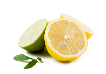 Lemons and Limes with leaves  on white