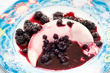 Delicious Panna cotta with mix berry fruit.