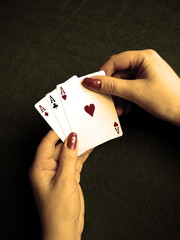 playing cards in the hands