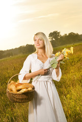 Beautiful young woman with a basket