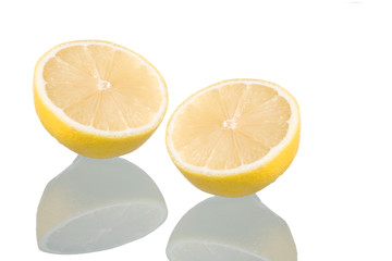 Sliced lemon, isolated on white background with reflection