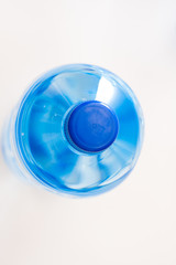 bottles of clear water with blue cap