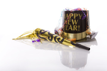 Party favors including top hat that says Happy New Year