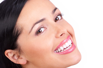 Beautiful young woman smiling. Isolated over white  background.