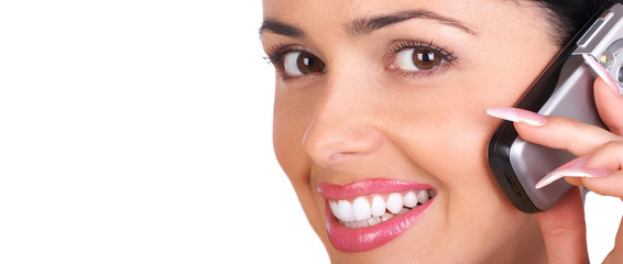Young smiling woman calling by  phone. Over white background.