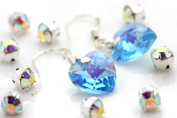 Obraz premium A pair of earrings puts together with shinny jewelry.